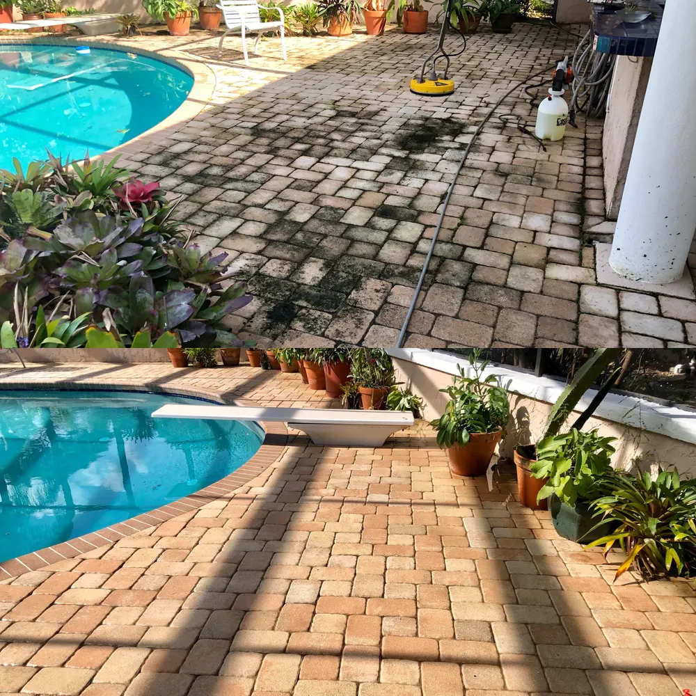 Brick pavers around a pool enclosure being cleaned