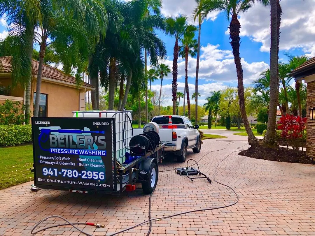 Beiler's Pressure Washing work truck and rig parked in a residential driveway